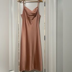 Satin pink spaghetti strap dress. Worn with one snag. Slit.